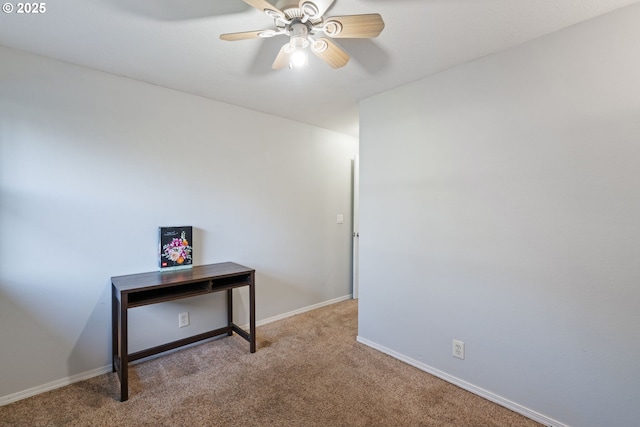 interior space with baseboards, carpet floors, and ceiling fan