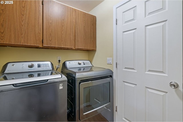 laundry room with washer and dryer and cabinet space