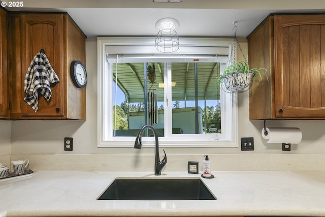 kitchen featuring plenty of natural light and sink