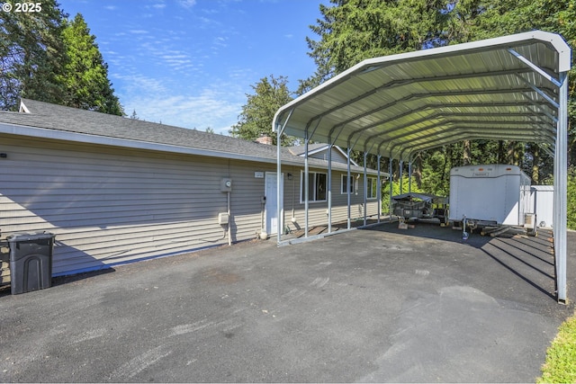 view of parking / parking lot with a carport