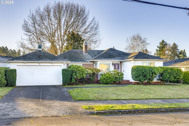 ranch-style house with a front yard, concrete driveway, a chimney, and an attached garage