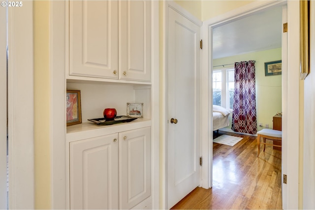 corridor featuring light wood-style floors