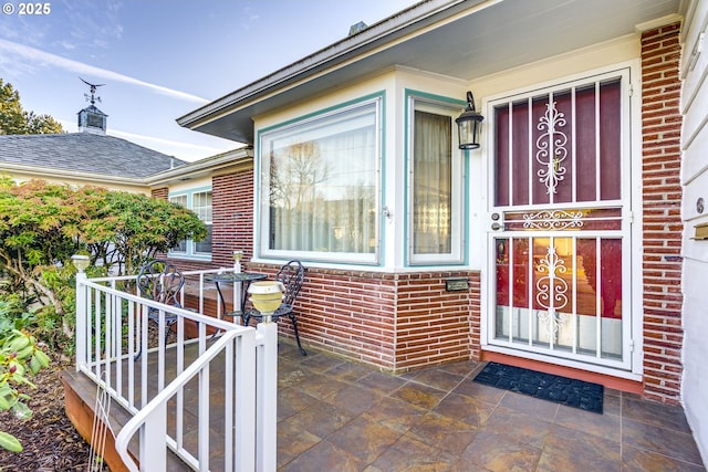 entrance to property with brick siding