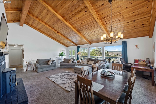 2144 Hamilton St, North Bend, OR 97459 - dining room with high vaulted ceiling, a wood stove, carpet flooring, a chandelier, and wood ceiling