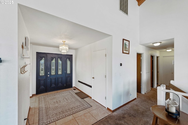 2144 Hamilton St, North Bend, OR 97459 - tiled entrance foyer with a chandelier, baseboards, and a towering ceiling