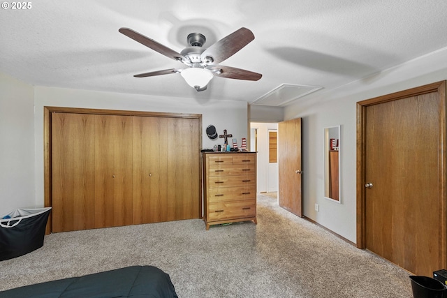 2144 Hamilton St, North Bend, OR 97459 - carpeted bedroom with attic access, ceiling fan, a closet, and a textured ceiling