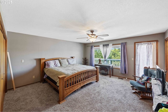 2144 Hamilton St, North Bend, OR 97459 - carpeted bedroom featuring a textured ceiling, baseboards, and ceiling fan