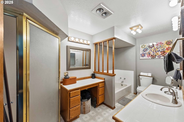 2144 Hamilton St, North Bend, OR 97459 - bathroom featuring toilet, a garden tub, tile patterned floors, a textured ceiling, and vanity