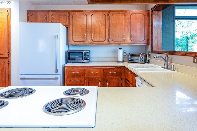 kitchen featuring sink and white appliances