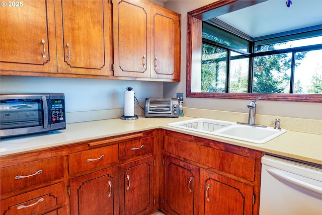 kitchen with dishwasher and sink