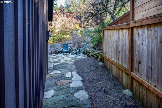 view of side of property featuring a patio