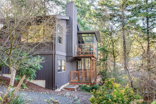 view of side of property with a sunroom