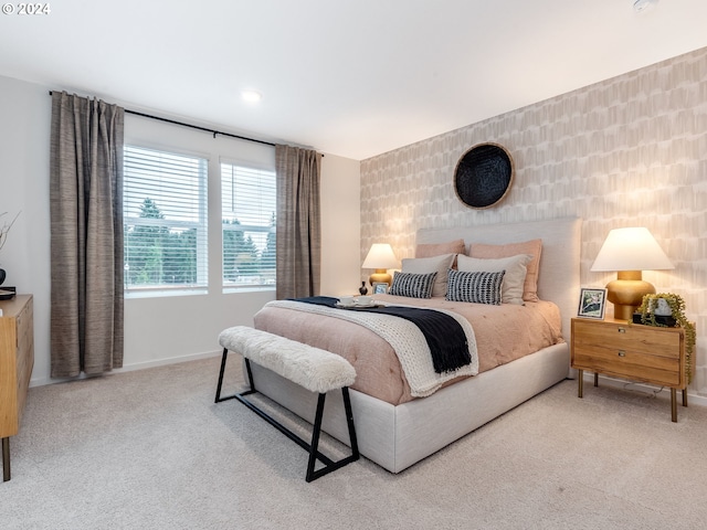 bedroom with light colored carpet