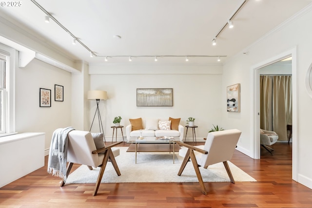 1005 SW Park Ave Unit 607, Portland, OR 97205 - living area featuring track lighting, wood finished floors, baseboards, and crown molding