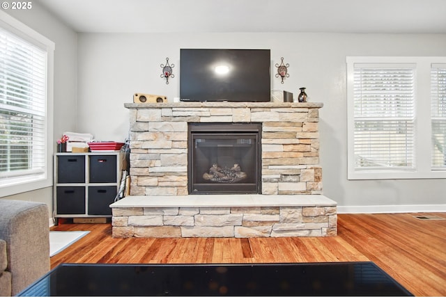 8535 SW Oleson Rd, Portland, OR 97223 - room details featuring baseboards, visible vents, wood finished floors, and a fireplace