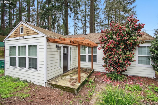 8535 SW Oleson Rd, Portland, OR 97223 - exterior space with a pergola and a shingled roof