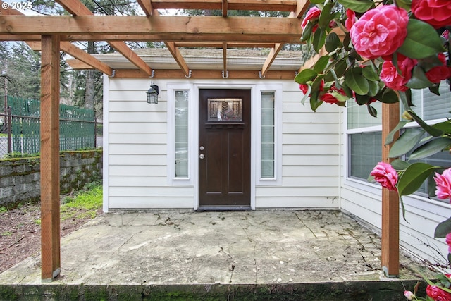 8535 SW Oleson Rd, Portland, OR 97223 - doorway to property with a patio, a pergola, and fence
