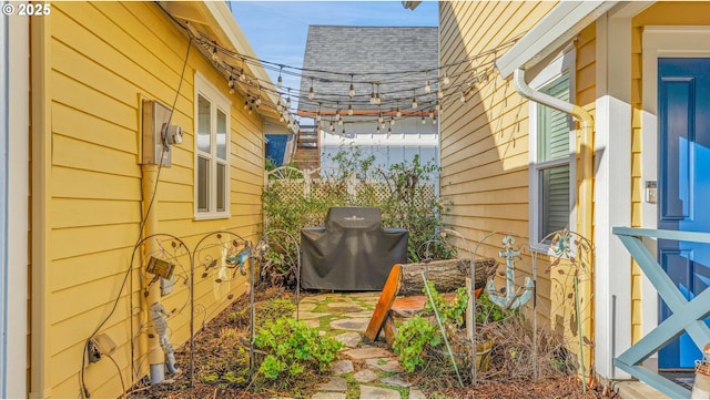 2781 SW Coast Ave, Lincoln City, OR 97367 - view of property exterior featuring roof with shingles and fence