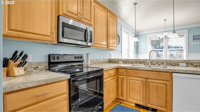 2781 SW Coast Ave, Lincoln City, OR 97367 - kitchen with stainless steel microwave, black electric range oven, dishwasher, a sink, and a chandelier