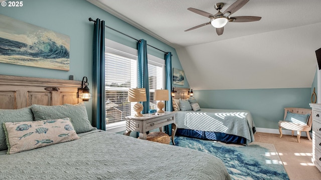 2781 SW Coast Ave, Lincoln City, OR 97367 - carpeted bedroom with vaulted ceiling, baseboards, and a ceiling fan