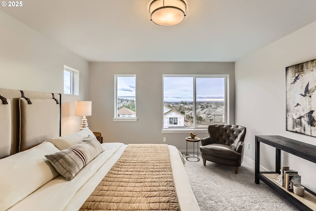 carpeted bedroom with baseboards