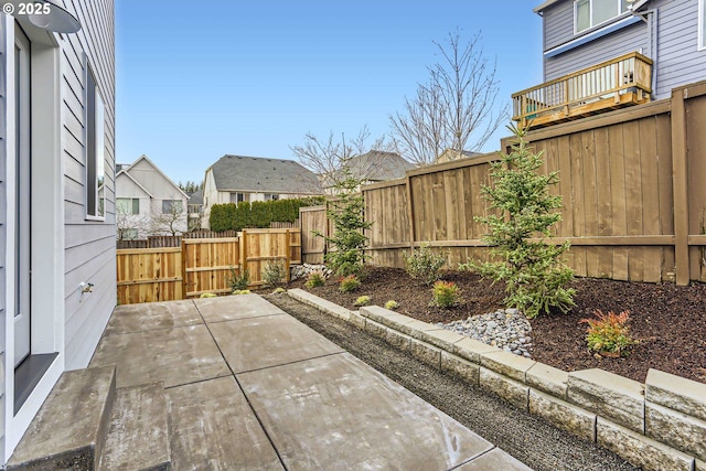 view of patio with a fenced backyard and a gate