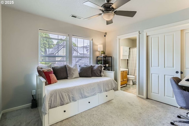 768 NE 70th Ave, Hillsboro, OR 97124 - bedroom featuring light carpet, baseboards, ensuite bathroom, and ceiling fan