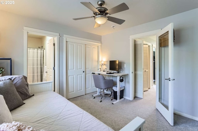 768 NE 70th Ave, Hillsboro, OR 97124 - bedroom with an office area, carpet floors, ensuite bath, baseboards, and ceiling fan