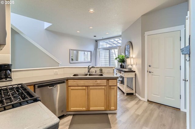 768 NE 70th Ave, Hillsboro, OR 97124 - kitchen with a sink, dishwasher, a peninsula, light wood-style flooring, and recessed lighting