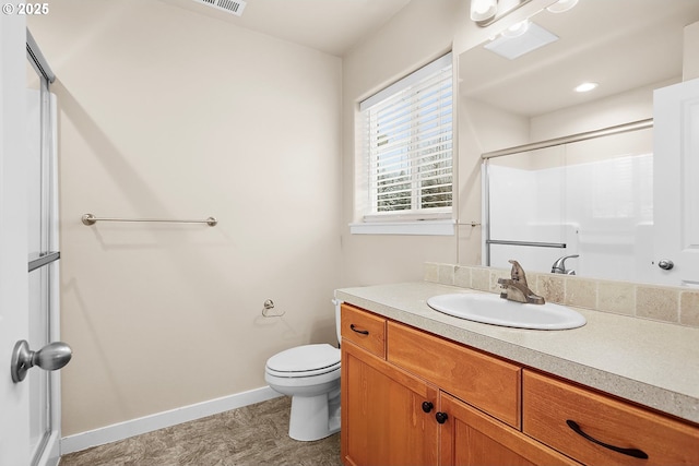 bathroom featuring an enclosed shower, vanity, and toilet