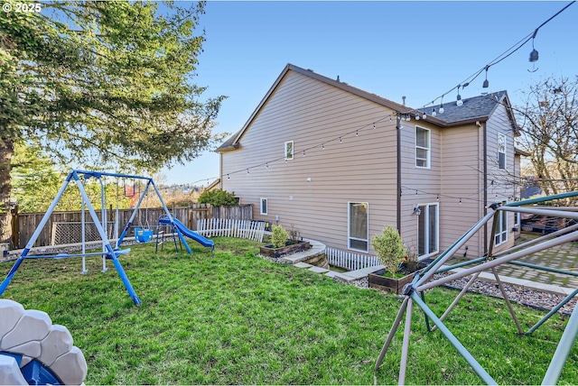 exterior space with a playground and a yard