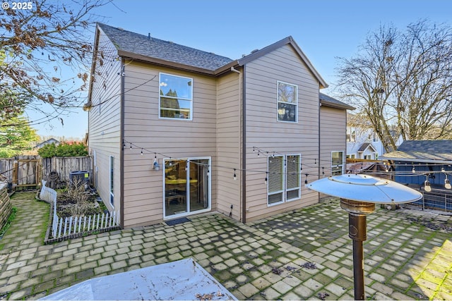 back of property featuring a patio area and central AC