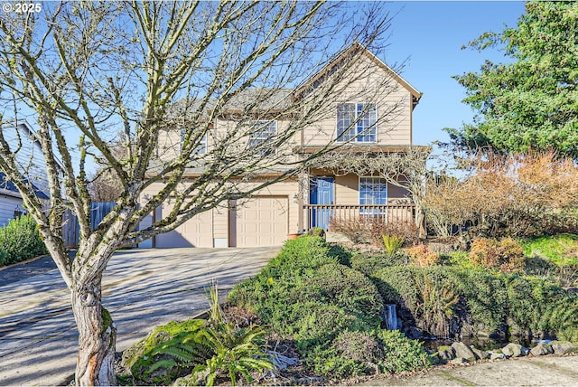 view of property with a porch and a garage