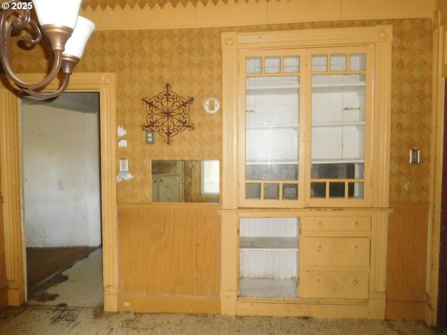 unfurnished bedroom featuring light colored carpet and a closet