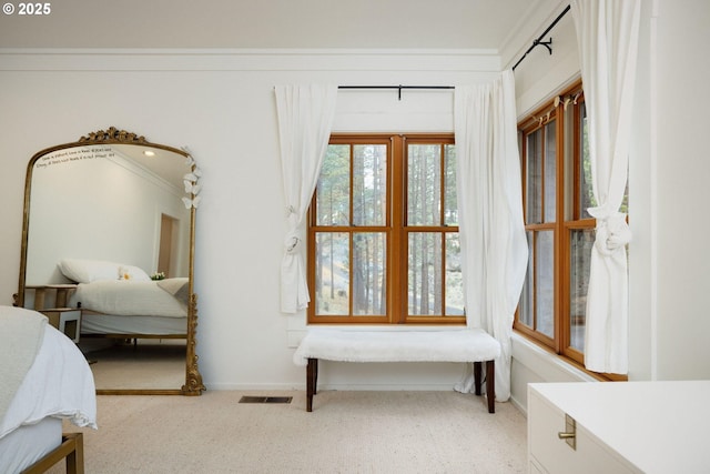 carpeted bedroom featuring ornamental molding