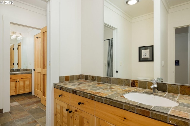 bathroom featuring vanity and ornamental molding