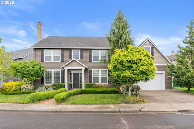 16041 NW Trakehner Way, Portland, OR 97229 - view of front facade featuring concrete driveway, a front lawn, and a chimney