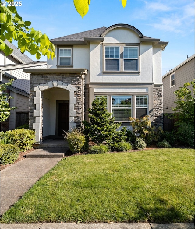 16849 SW Friendly Ln, Beaverton, OR 97007 - traditional-style home featuring stucco siding, stone siding, and a front lawn