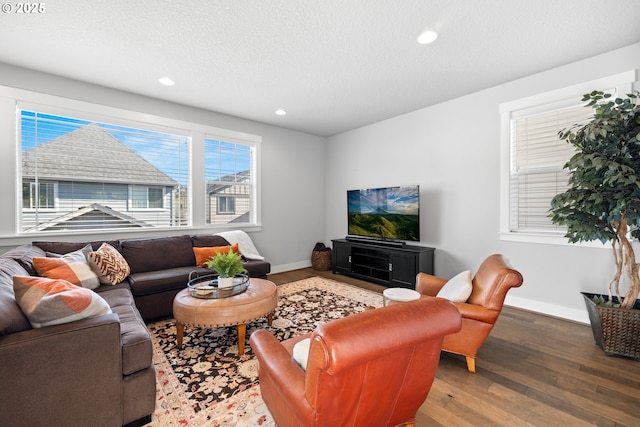 16849 SW Friendly Ln, Beaverton, OR 97007 - living room featuring wood finished floors, baseboards, recessed lighting, and a textured ceiling