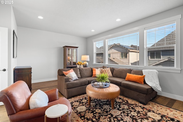 16849 SW Friendly Ln, Beaverton, OR 97007 - living room with wood finished floors, baseboards, and recessed lighting