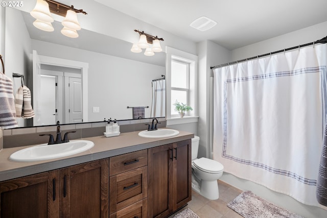 16849 SW Friendly Ln, Beaverton, OR 97007 - full bath featuring toilet, tile patterned flooring, and double vanity