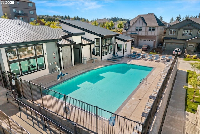 16849 SW Friendly Ln, Beaverton, OR 97007 - community pool with a residential view, fence, and a patio