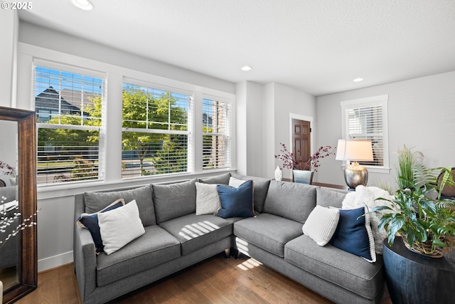 16849 SW Friendly Ln, Beaverton, OR 97007 - living room with plenty of natural light, dark wood-style flooring, recessed lighting, and baseboards