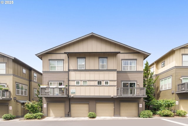 1020 SW 170th Ave Unit 203, Beaverton, OR 97003 - view of front of home featuring an attached garage and board and batten siding