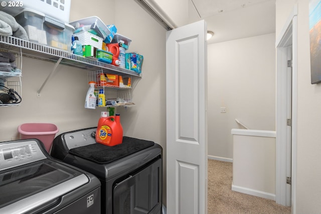 1020 SW 170th Ave Unit 203, Beaverton, OR 97003 - laundry area with washing machine and clothes dryer, carpet floors, and baseboards