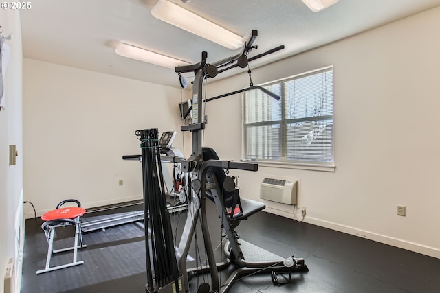 exercise room featuring a wall mounted air conditioner