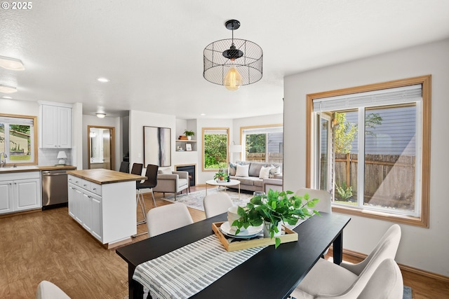 6309 NE 45th Ave, Portland, OR 97218 - dining room featuring wood finished floors, recessed lighting, and baseboards
