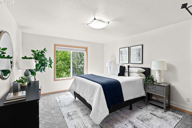 6309 NE 45th Ave, Portland, OR 97218 - carpeted bedroom featuring baseboards and a textured ceiling