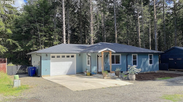 ranch-style house featuring a garage