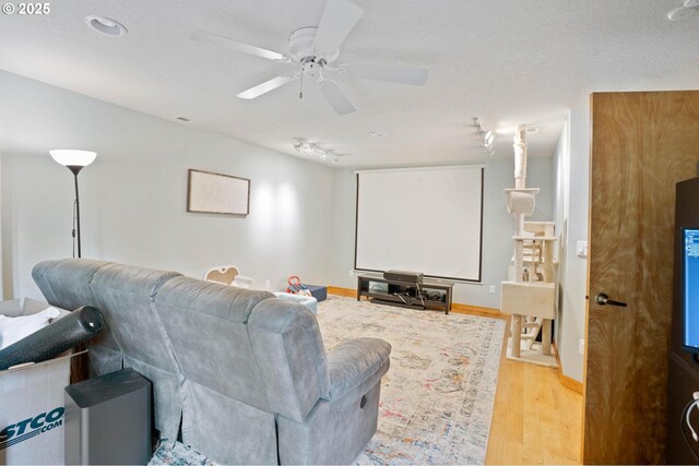 18020 SE 370th Ave, Sandy, OR 97055 - home theater featuring track lighting, light wood-style floors, and a ceiling fan